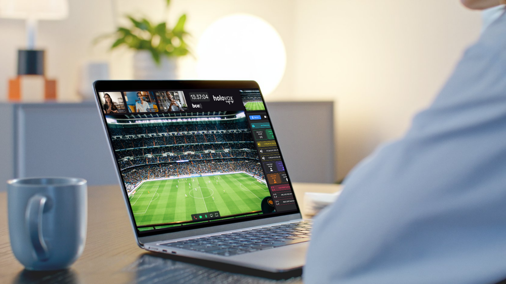 Holovox Remote Commentary platform displaying a live football match on a laptop